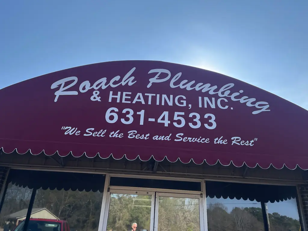 The Roach Plumbing & Heating storefront awning on Greenwood Rd in Shreveport